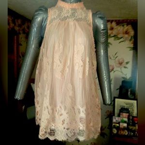 Medium light pink sleeveless top